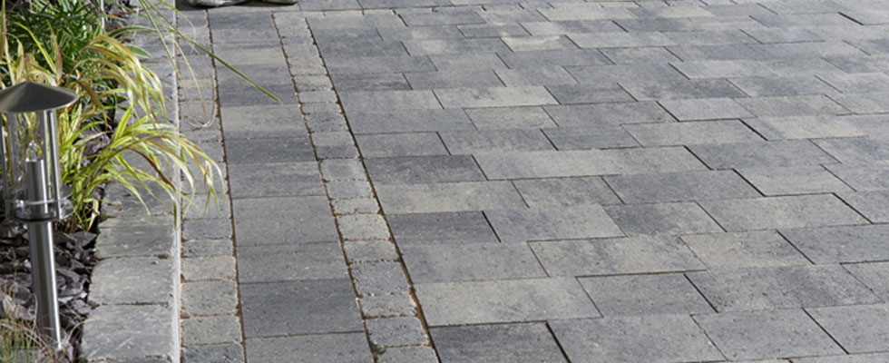 Grey paved driveway, laid by Dirve Clean